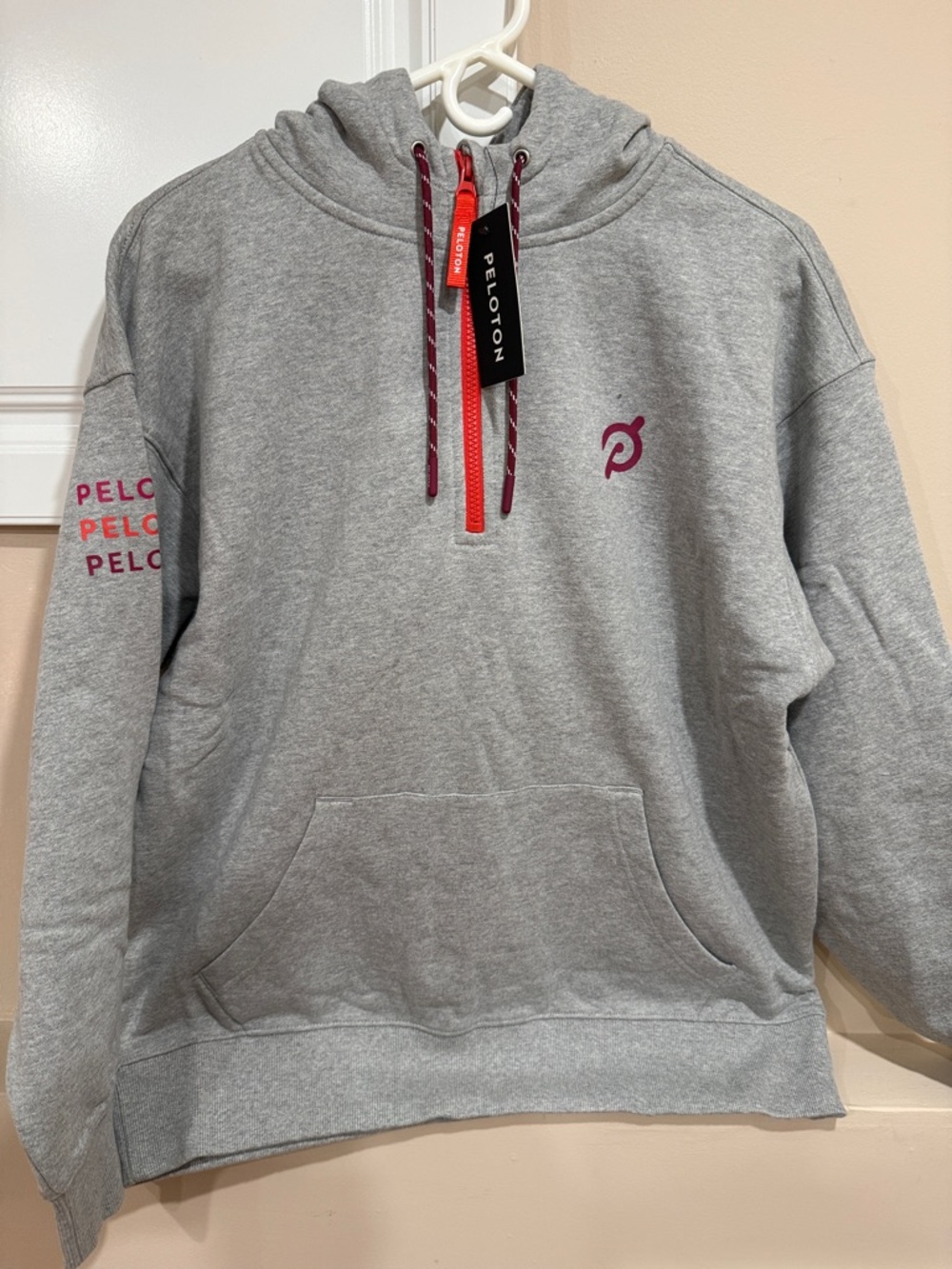 Peloton Gray Hoodie with Pink Logo and Red Zip Accent